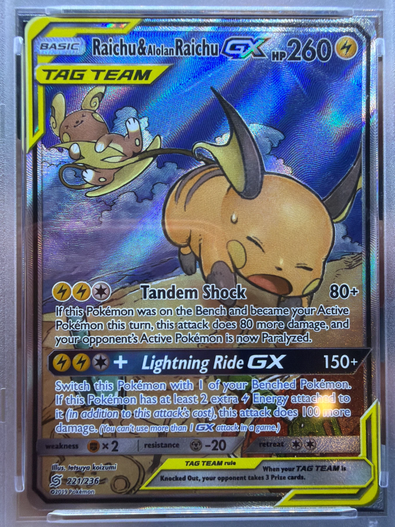 Raichu & Alolan Raichu GX 221/236 Unified Minds front card photo in PokeToGrade pregrading report