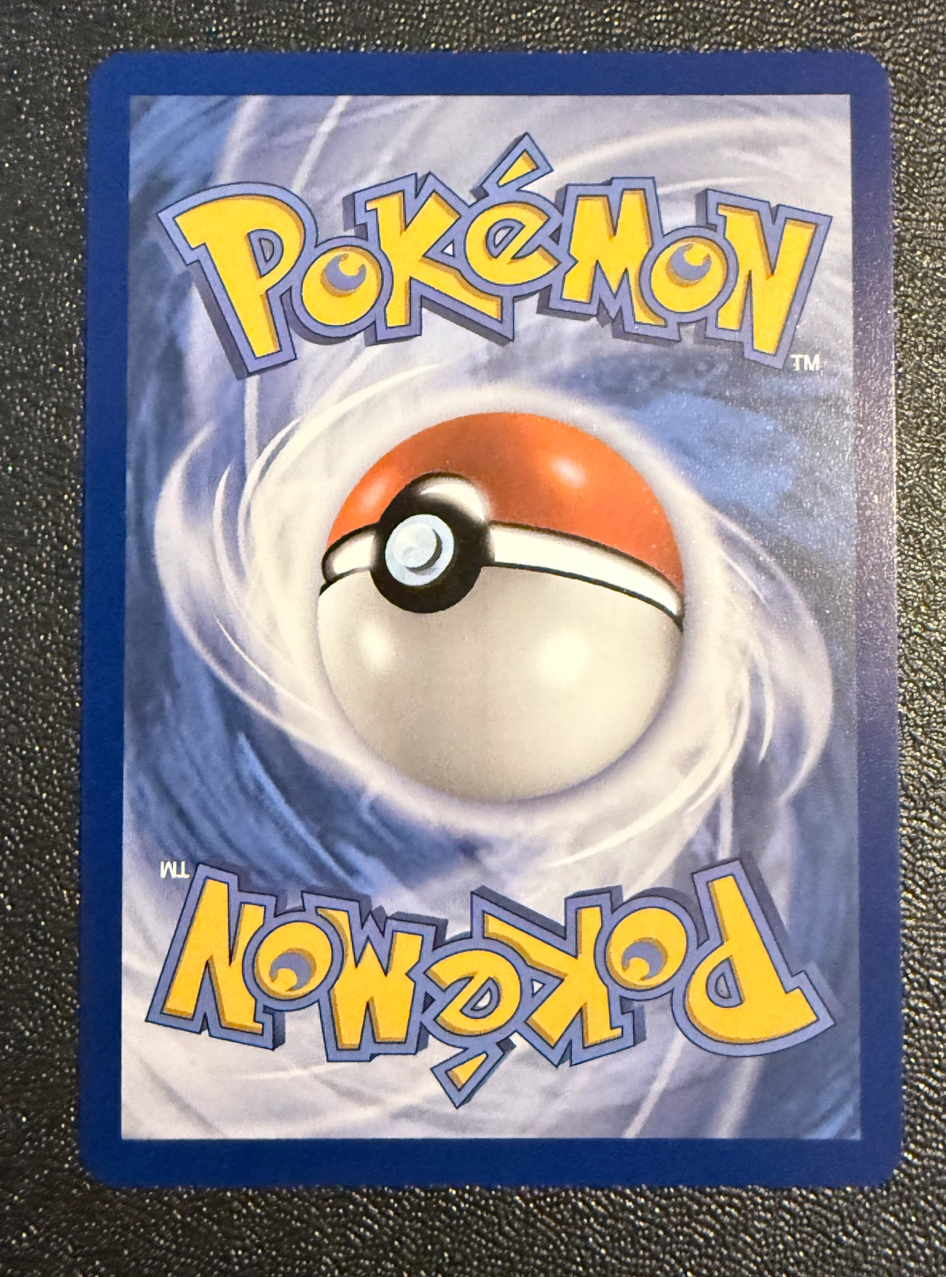 Gholdengo 142/128 30th Celebration back card photo in PokeToGrade pregrading report