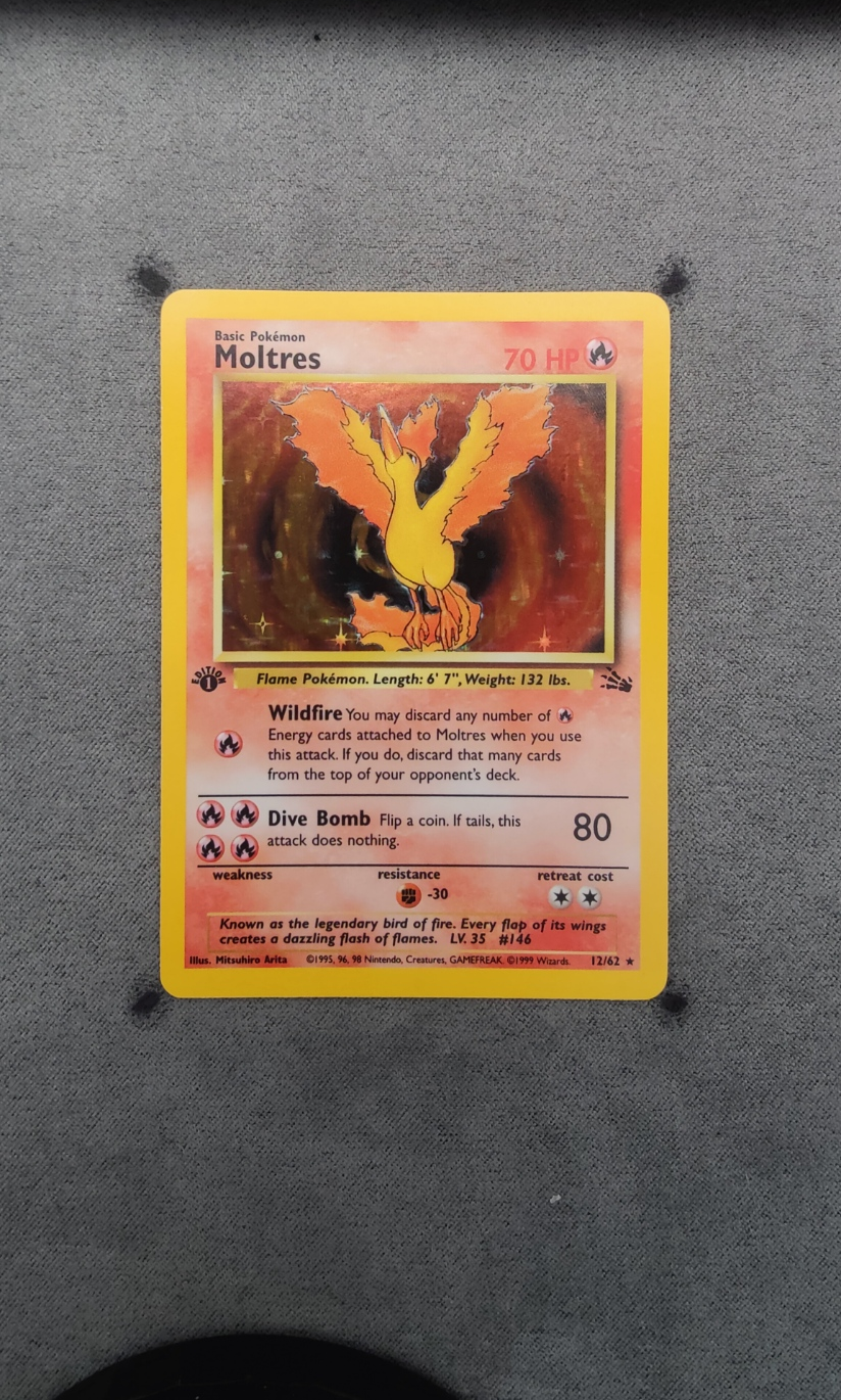 Moltres 012/62 (First Edition Stamp) Fossil front card photo in PokeToGrade pregrading report