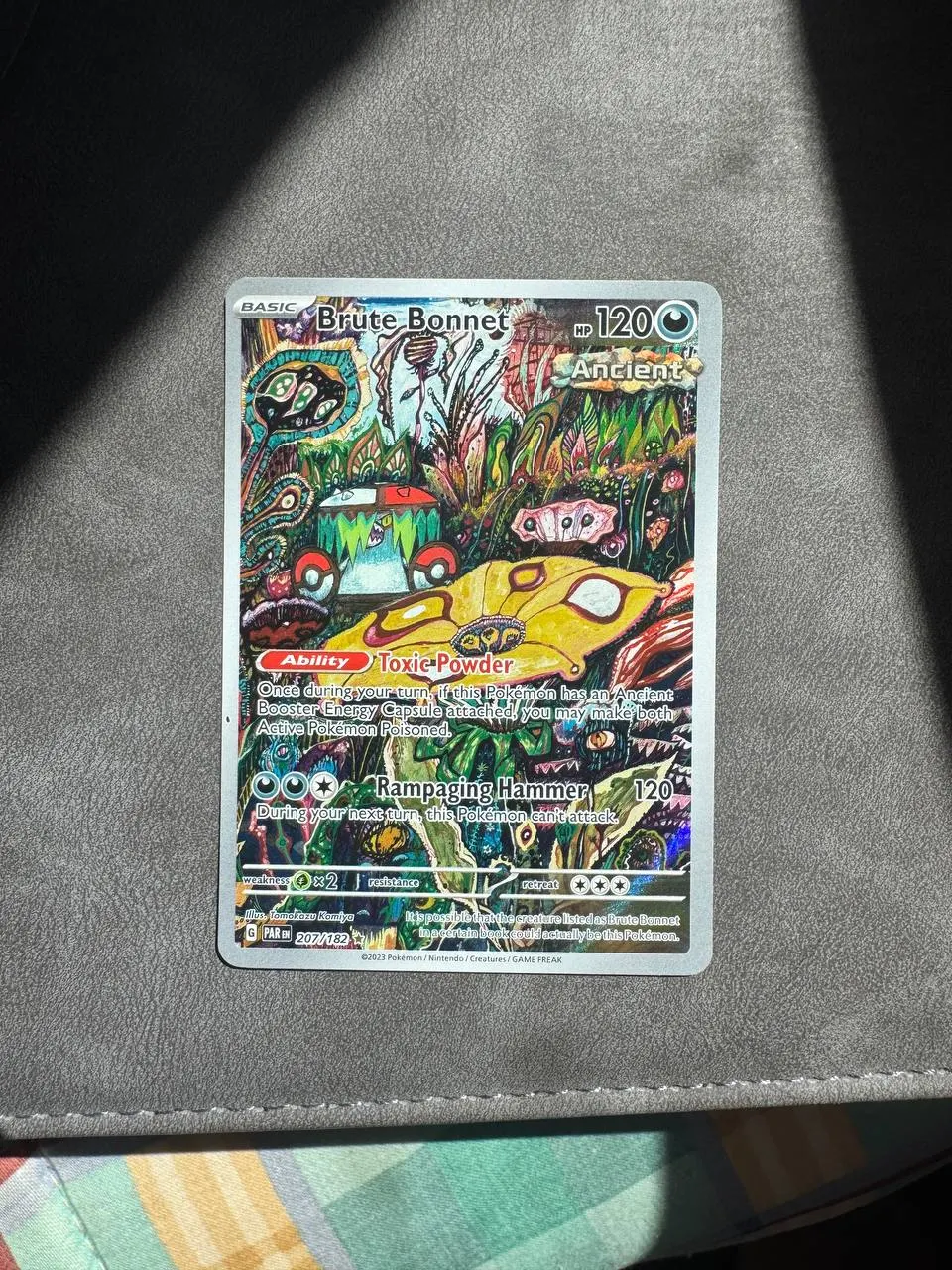 Brute Bonnet 207/182 Paradox Rift front card photo in PokeToGrade pregrading report