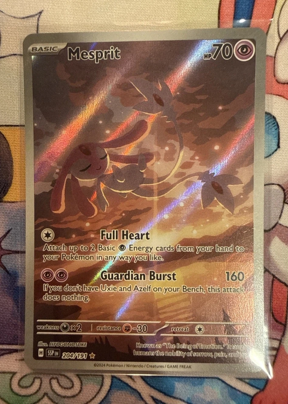 Mesprit 204/191 Surging Sparks front card photo in PokeToGrade pregrading report